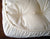 100% certified organic cotton with cotton elastic at the corners for a snug fit over the bassinet mattress